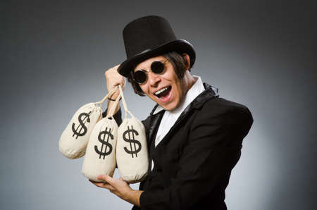 Funny man with dollar sacksの写真素材