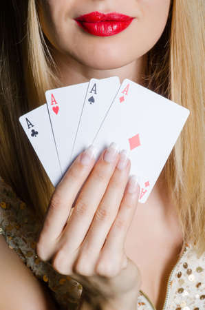Young woman in casino gambling conceptの写真素材