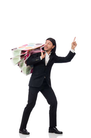 Black suit man holding plastic bags isolated on whiteの写真素材