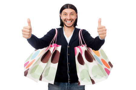 Young man holding plastic bags isolated on whiteの写真素材