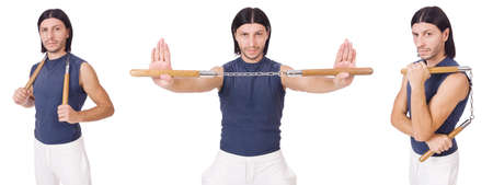 Funny karate fighter with nunchucks on whiteの写真素材