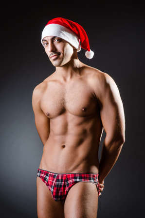 Ripped young man in studio conceptの写真素材