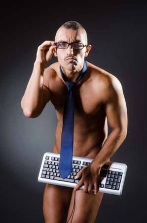 Ripped young man in studio conceptの写真素材