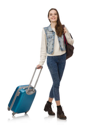 Smiling caucasian girl walking with suitcase isolated on whiteの写真素材