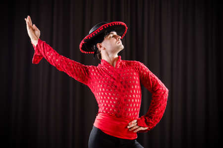Man dancing spanish dance in red clothingの写真素材