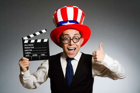 Man with american hat and movie boardの写真素材