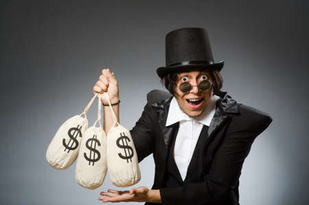 Funny man with dollar sacksの写真素材