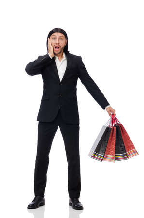 Black suit man holding plastic bags isolated on whiteの写真素材