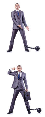 Businessman with shackles on whiteの写真素材