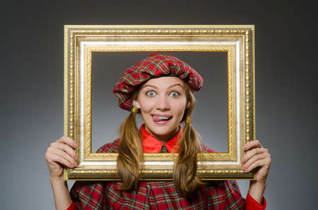 Woman in scottish clothing in art conceptの写真素材
