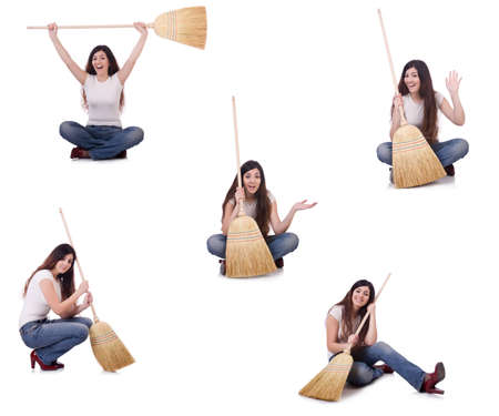 Woman with broom isolated on whiteの写真素材