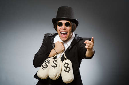 Funny man with dollar sacksの写真素材