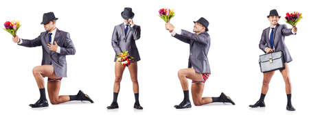 Nude businessman presenting flowers on whiteの写真素材