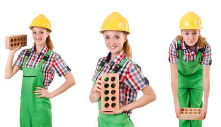 Woman with bricks isolated on whiteの写真素材