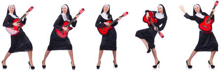 Nun with guitar isolated on whiteの写真素材
