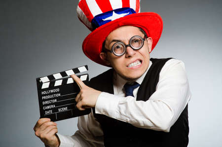 Man with american hat and movie boardの写真素材