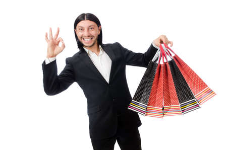 Black suit man holding plastic bags isolated on whiteの写真素材