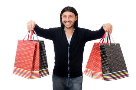 Young man holding plastic bags isolated on whiteの写真素材