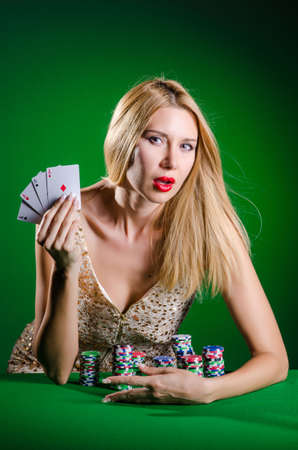 Young woman in casino gambling conceptの写真素材