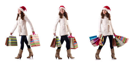 Woman in winter clothing doing christmas shoppingの写真素材
