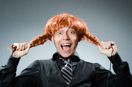 Funny man with red hair wigの写真素材