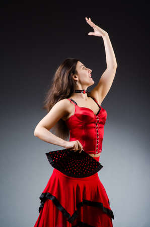 Woman with fan dancing dancesの写真素材