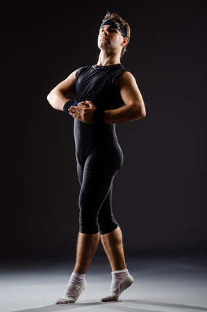 Young man training for ballet dancesの写真素材