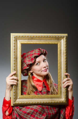 Woman in scottish clothing in art conceptの写真素材