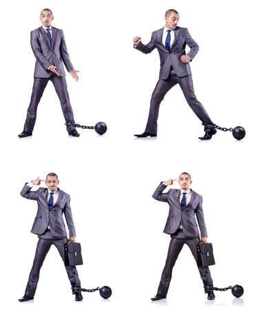 Businessman with shackles on whiteの写真素材