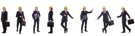 Young architect wearing hardhat on whiteの写真素材