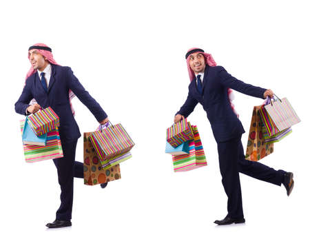 Arab man with shopping gifts on whiteの写真素材