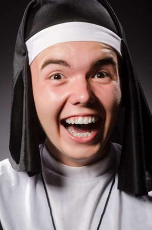 Funny man wearing nun clothingの写真素材