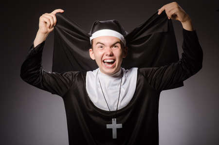 Funny man wearing nun clothingの写真素材