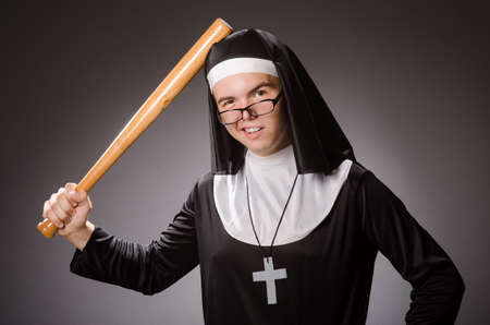 Funny man wearing nun clothingの写真素材