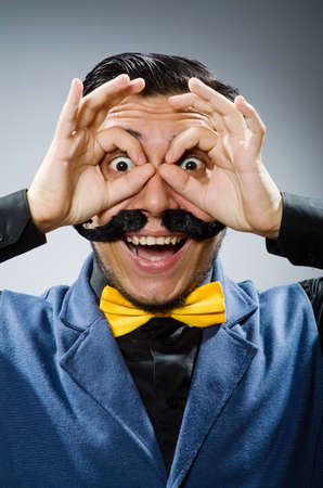 Funny man against dark backgroundの写真素材