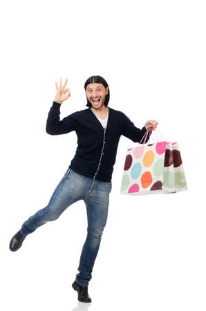 Young man holding plastic bags isolated on whiteの写真素材