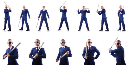 Handsome businessman with bat on whiteの写真素材