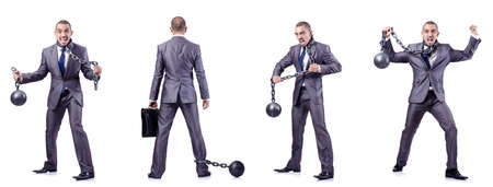 Businessman with shackles on whiteの写真素材