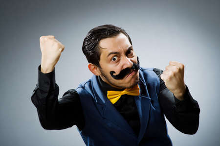 Funny man against dark backgroundの写真素材