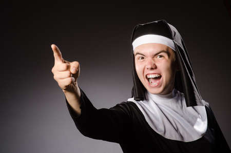 Funny man wearing nun clothingの写真素材