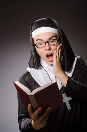 Funny man wearing nun clothingの写真素材