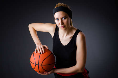Woman with basketball in sport conceptの写真素材