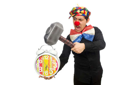 Funny clown with hammer and clock on whiteの写真素材