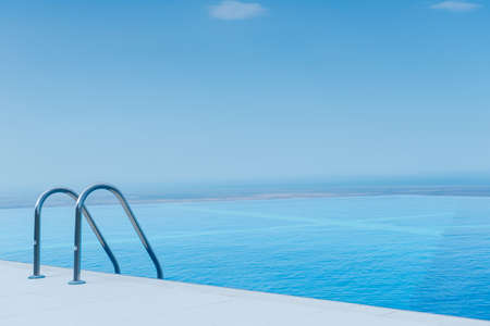 Infinity pool on the bright summer dayの写真素材