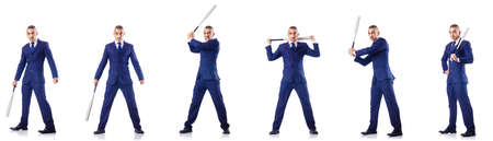 Handsome businessman with bat on white