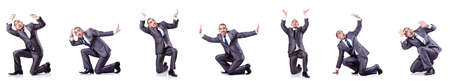 Businessman in various poses isolated on whiteの写真素材