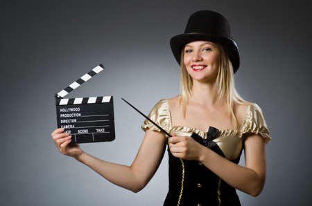 Funny woman in dark studio