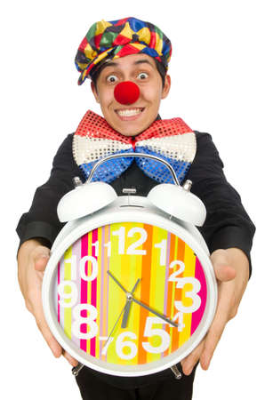 Funny clown with clock isolated on whiteの写真素材
