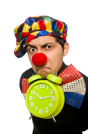 Funny clown with clock isolated on whiteの写真素材