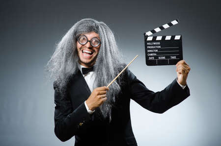 Funny man with movie clapboard